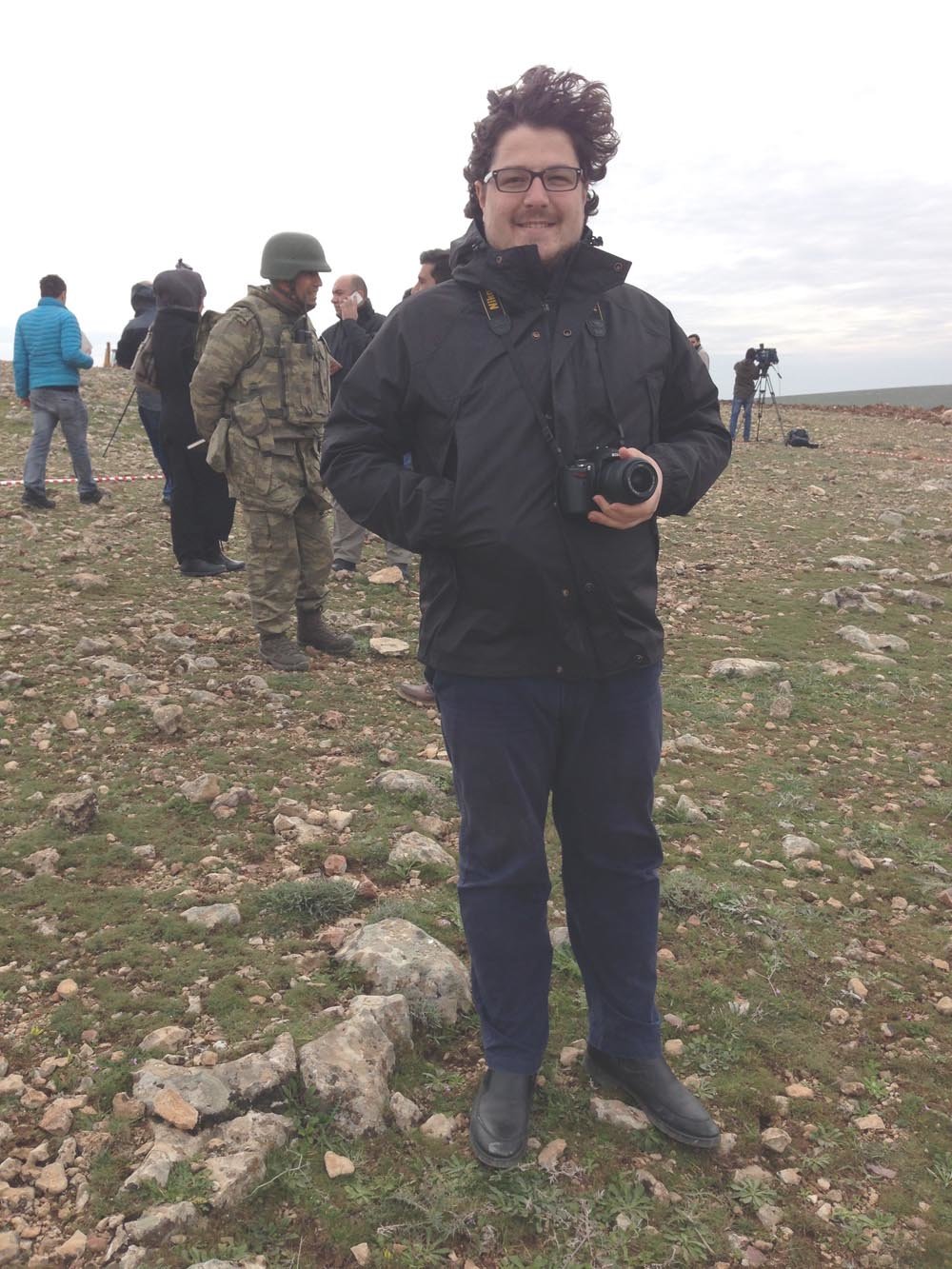 While a journalist in 2013, Omer Onder is at the Turkey and Syria border following a story about Syrian refugees entering Turkey.